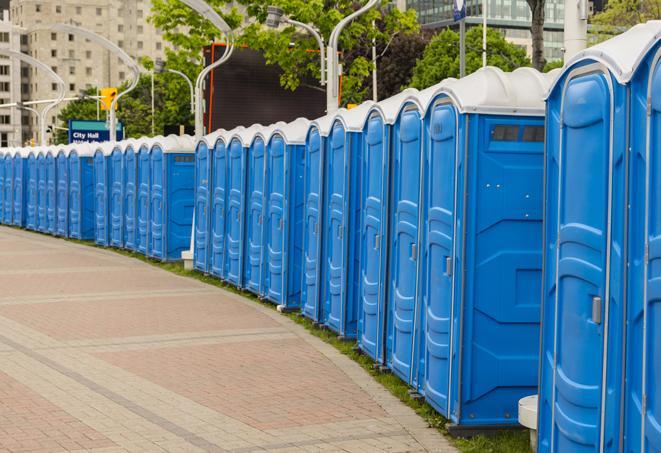 a row of portable restrooms at a fairground, offering visitors a clean and hassle-free experience in louise